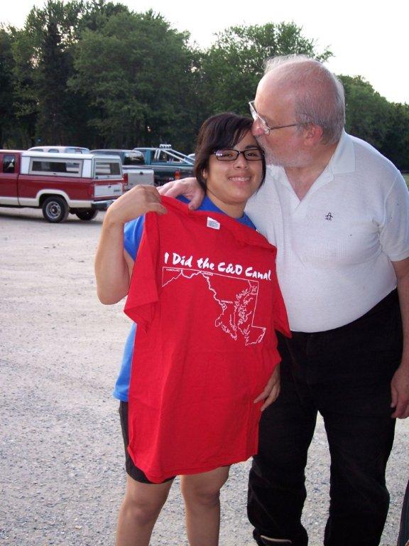 Craig congratulating Roxana with a T-shirt in August 2006 on her completion of bicycling the C&O Canal towpath