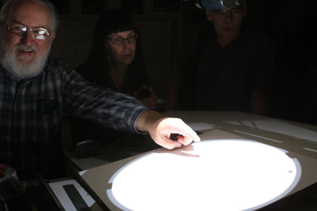Waff pointing at the black disk of Venus on the projected image of the sun, inside the 150-foot solar tower telescope on Mount Wilson Observatory. One of the last photographs of Waff, this picture was taken by Bell about 48 hours before his death